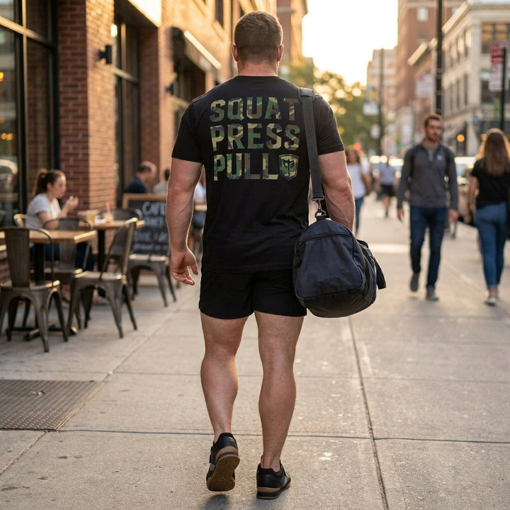 Squat Press Pull® tee in Black: SQUAT PRESS PULL in oversized woodland camo lettering stacked down the back