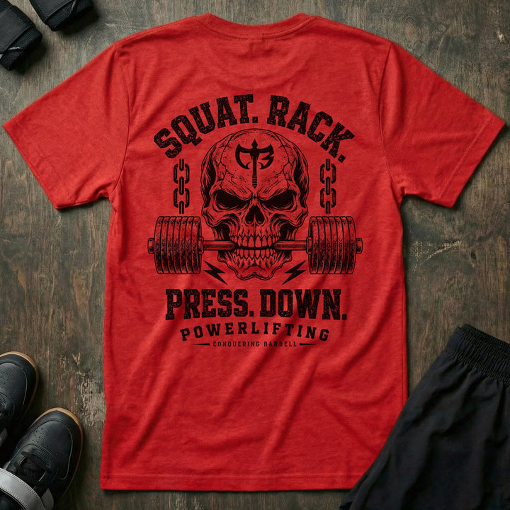 Squat. Rack. Press. Down. tee in Red: a skull with the CB shield biting down on a barbell between chains