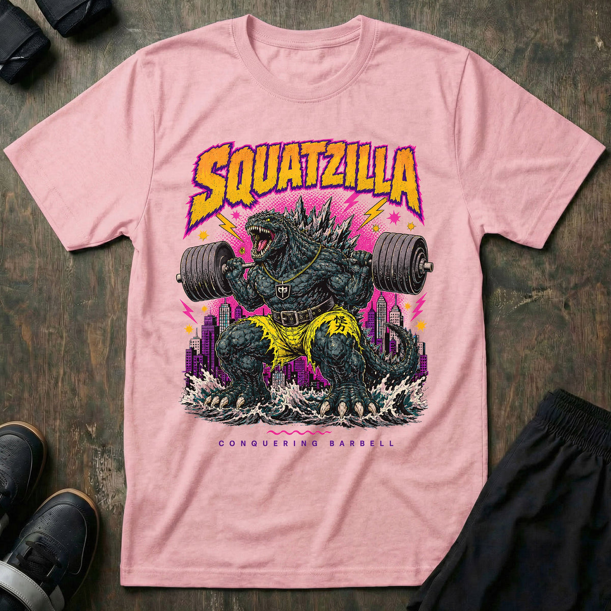 Squatzilla tee in Pink: a massive kaiju monster with a gold chain swinging