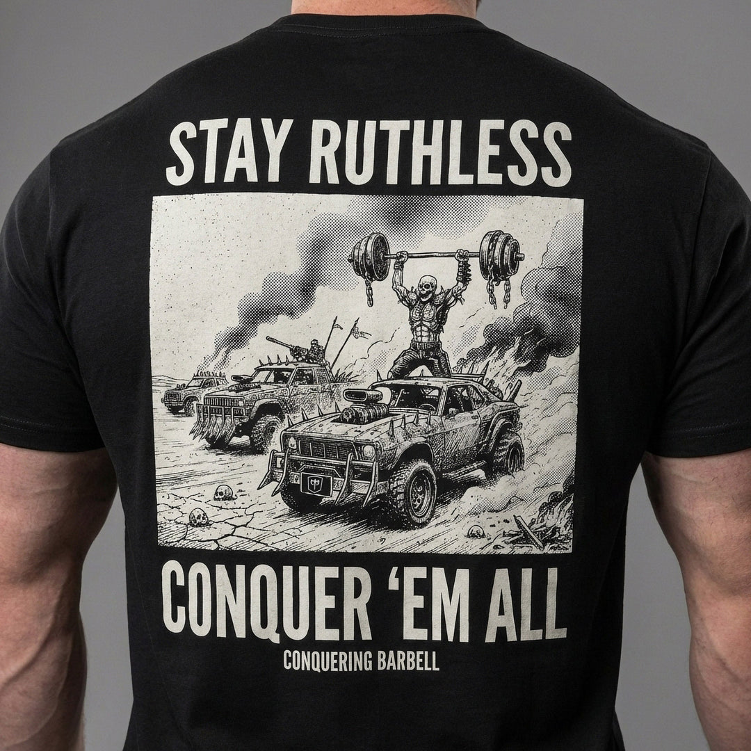Stay Ruthless tee in Black: a skeleton warrior pressing a massive barbell overhead atop a war rig