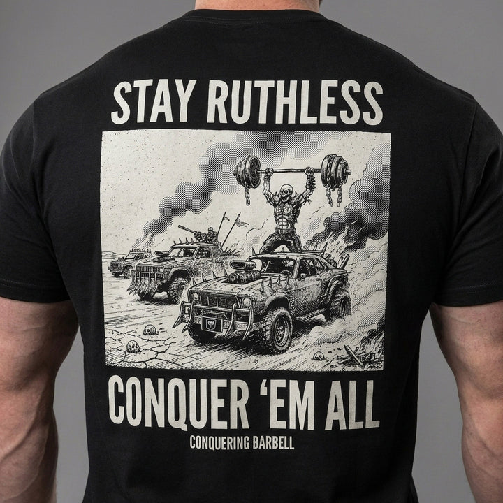 Stay Ruthless tee in Black: a skeleton warrior pressing a massive barbell overhead atop a war rig