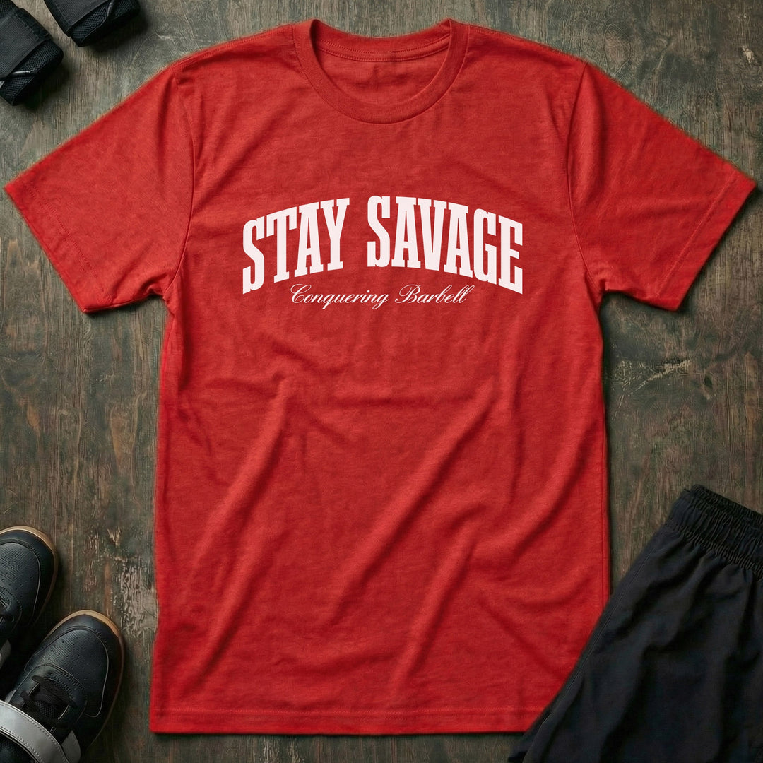 Stay Savage tee in Red: STAY SAVAGE in bold arched collegiate letters with Conquering Barbell script below