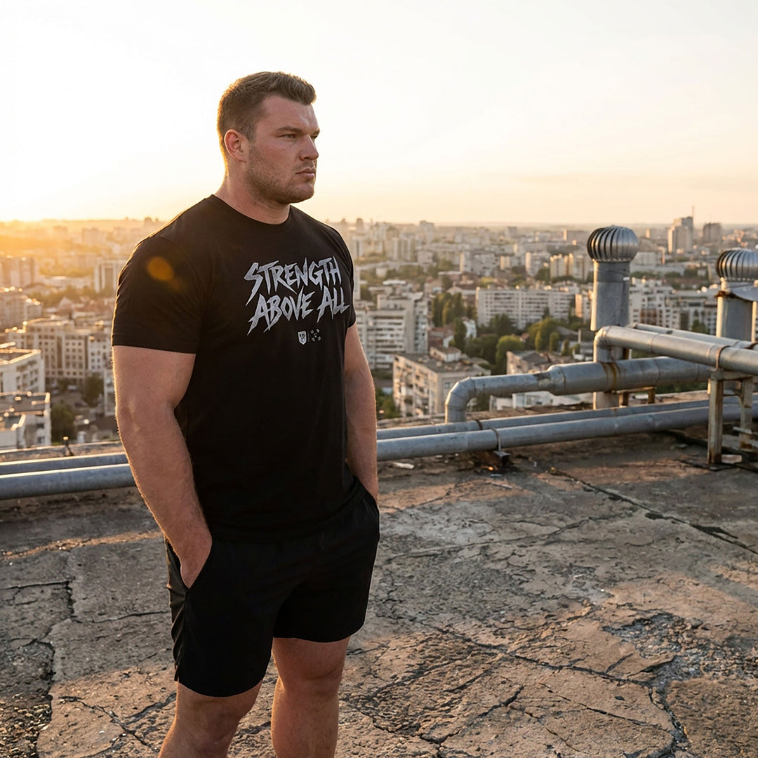 Strength Above All V2 tee in Black: STRENGTH ABOVE ALL in raw white brush lettering with small CB marks below