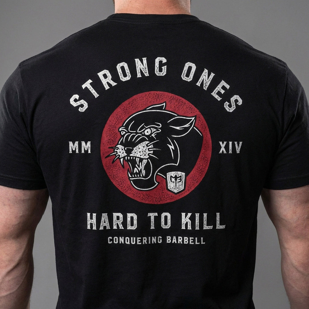Strong Ones Hard to Kill - on Black Tee - Conquering Barbell