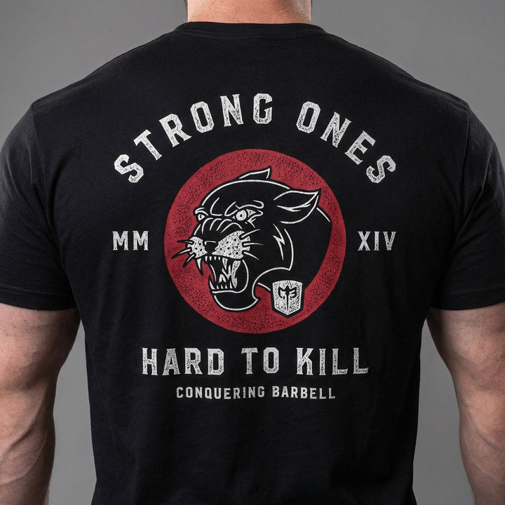 Strong Ones Hard to Kill - on Black Tee - Conquering Barbell