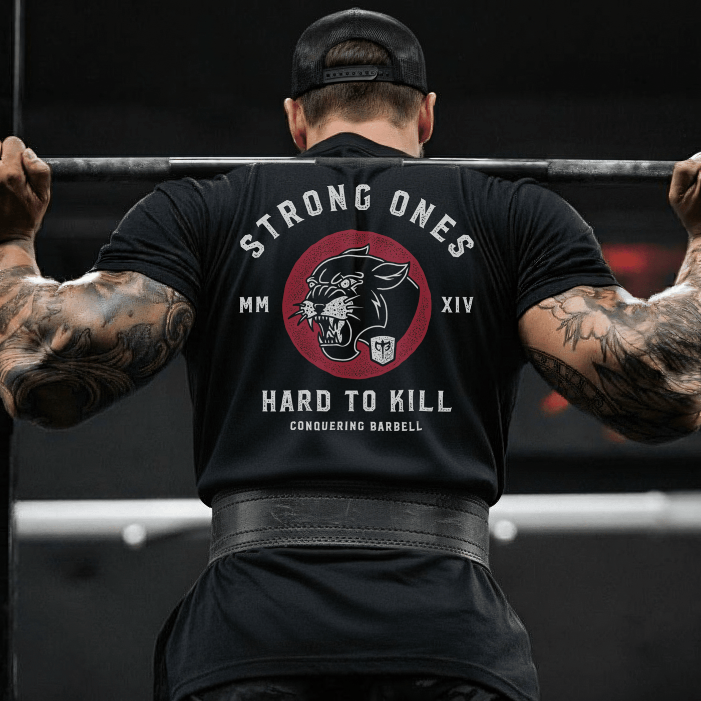 Strong Ones Hard to Kill - on Black Tee - Conquering Barbell