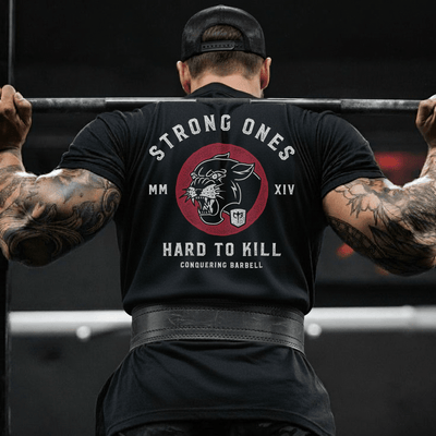 Strong Ones Hard to Kill - on Black Tee - Conquering Barbell