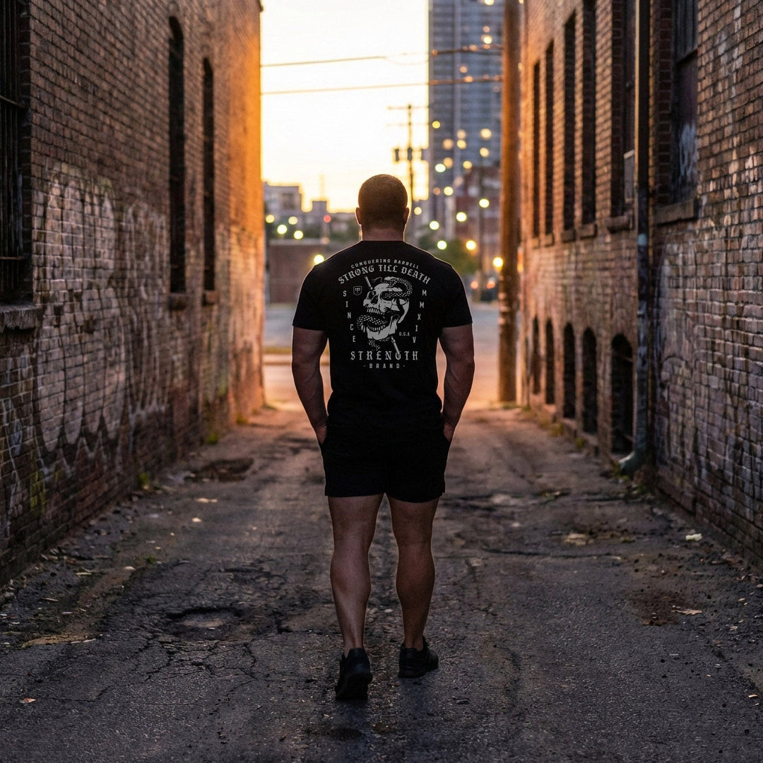 Strong Till Death The Original tee in Black: a skull wrapped by a serpent