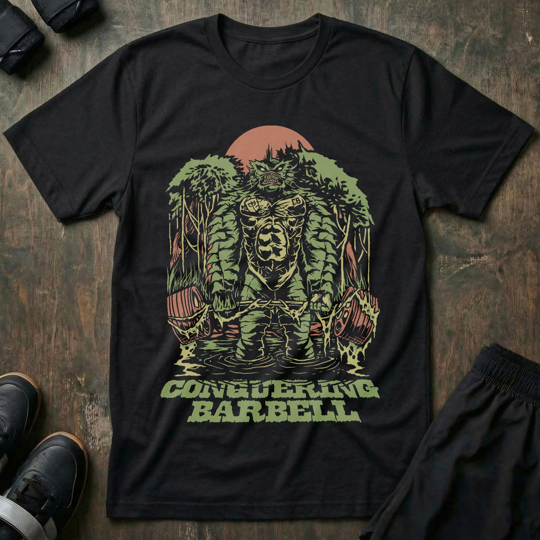 Swamp Monster tee in Black: a moss-covered swamp creature rising from the trees in front of a red sun