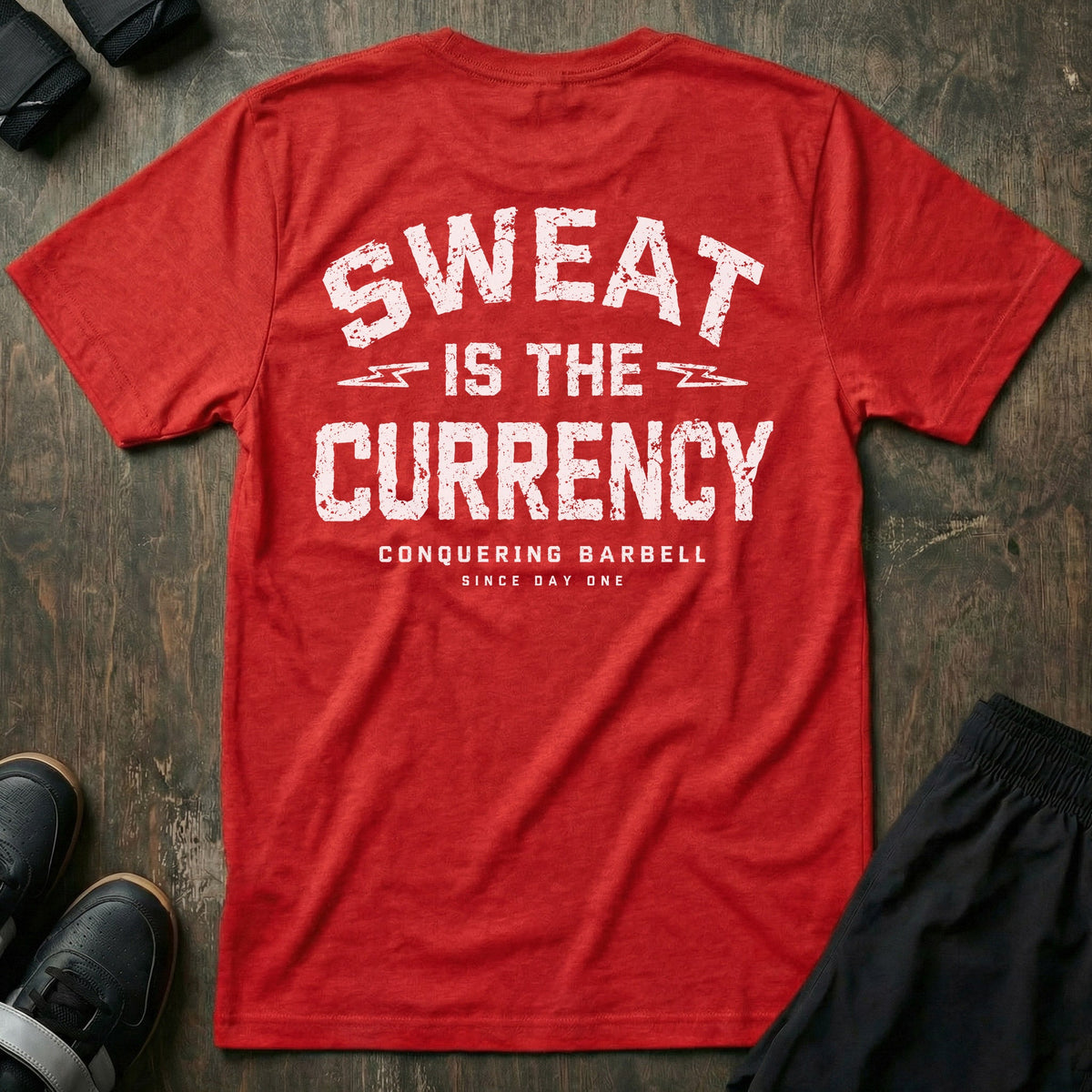 Sweat is the Currency tee in Red: SWEAT IS THE CURRENCY in bold distressed athletic block letters