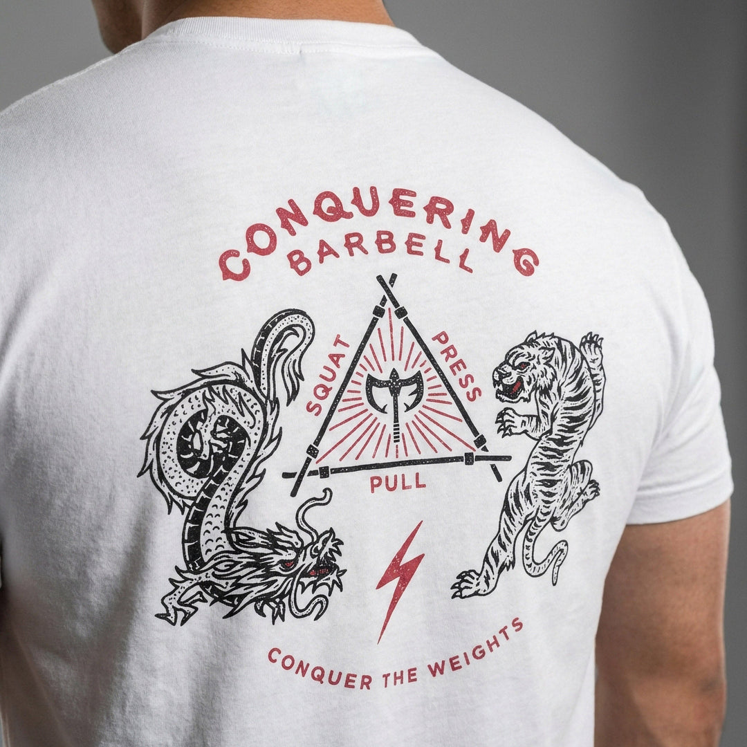 The Balance of Power tee in White: a dragon and a tiger flanking a triangle of the three lifts