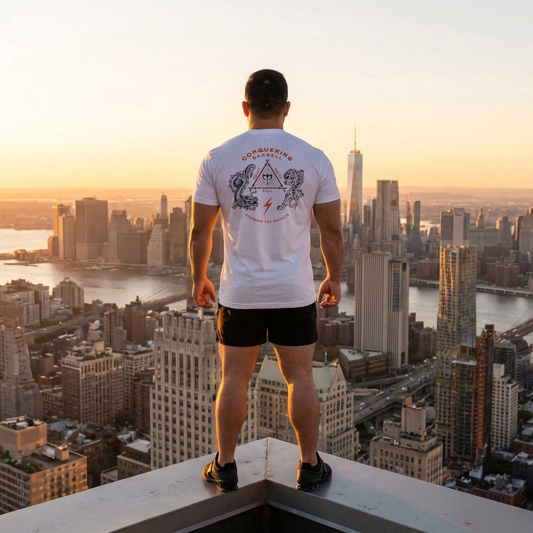 The Balance of Power tee in White: a dragon and a tiger flanking a triangle of the three lifts