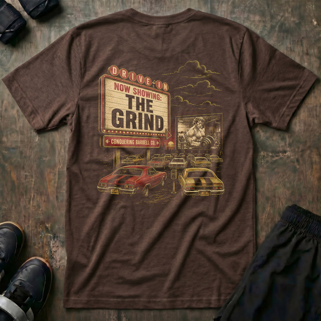 The Grind tee: a retro drive-in marquee reading NOW SHOWING