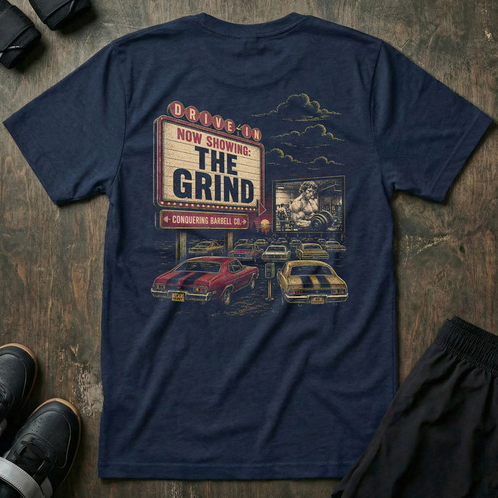 The Grind tee: a retro drive-in marquee reading NOW SHOWING
