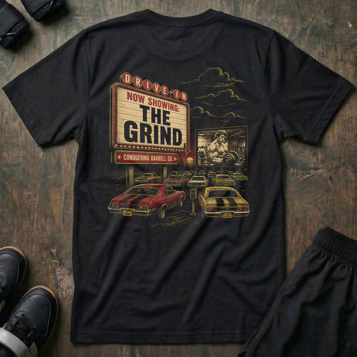 The Grind tee: a retro drive-in marquee reading NOW SHOWING