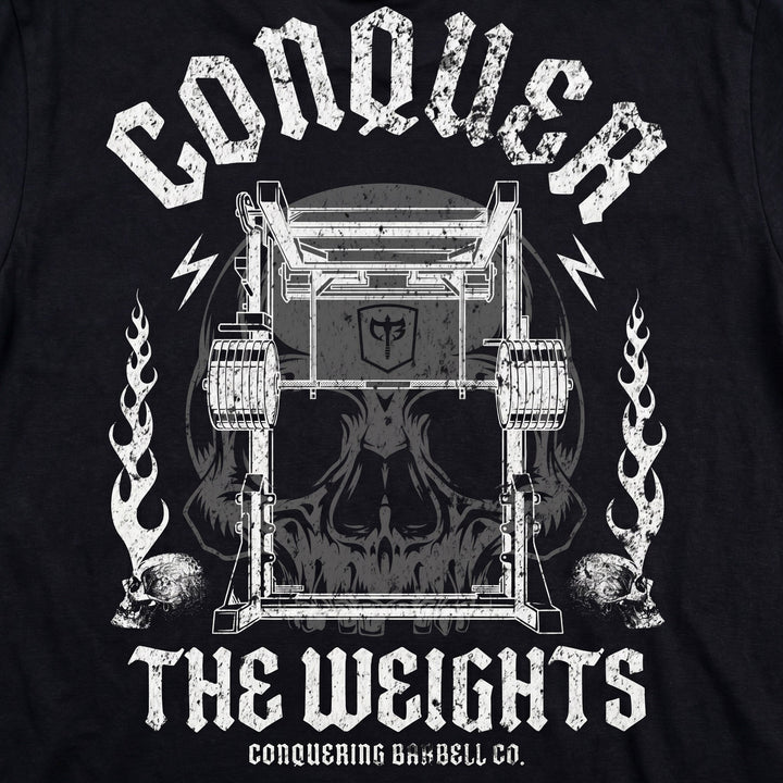 The Monolift tee in Black: a loaded monolift with a skull hidden inside the frame and flames at its sides