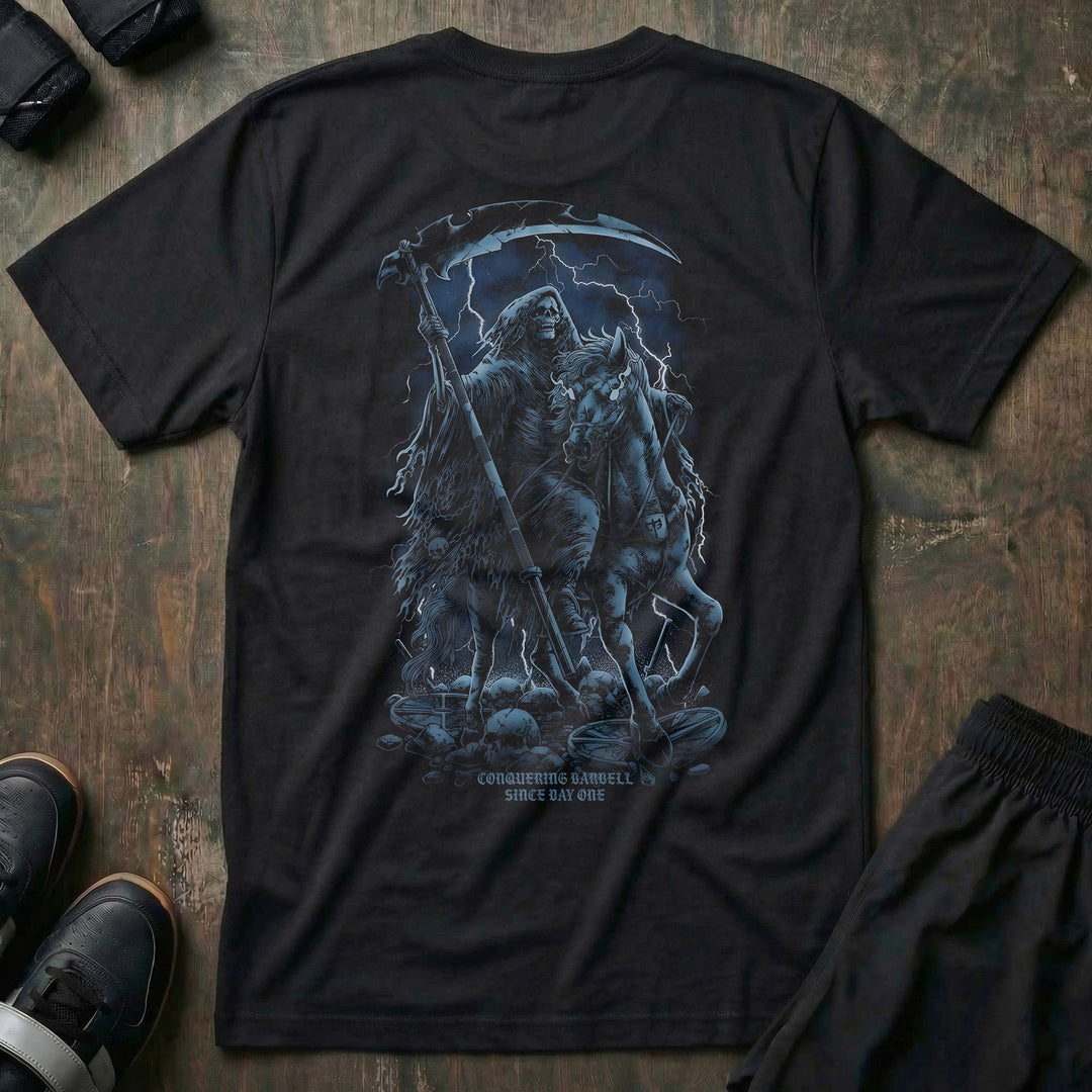 The Reaper tee in Black: a hooded reaper with his scythe riding out of the shadows in cold grey and steel blue