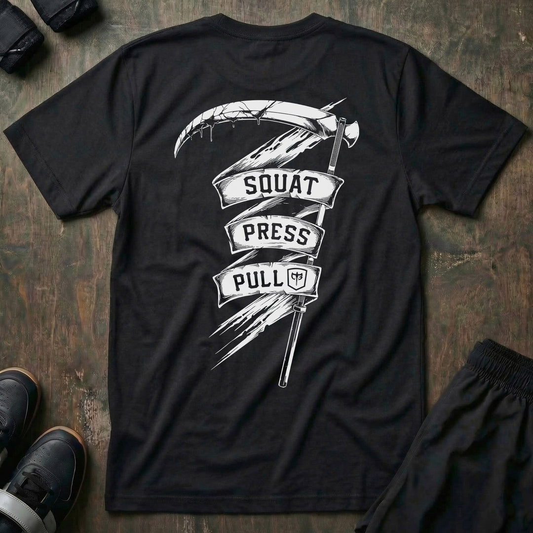 The Scythe Squat Press Pull® tee in Black: a reaper's scythe wrapped in a ribbon banner reading SQUAT PRESS PULL