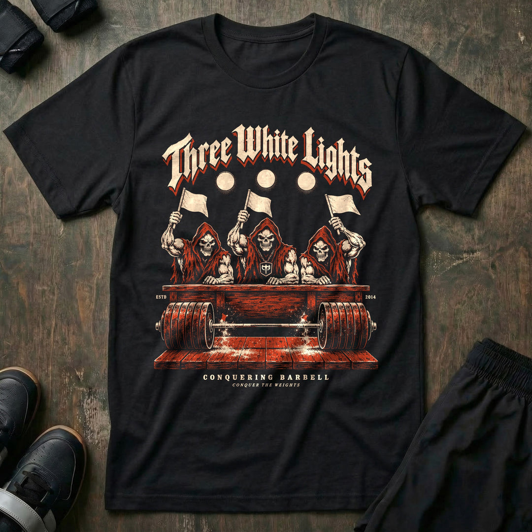Three White Lights - Tee front graphic in Black with three reaper judges raising white flags over a loaded barbell - Conquering Barbell