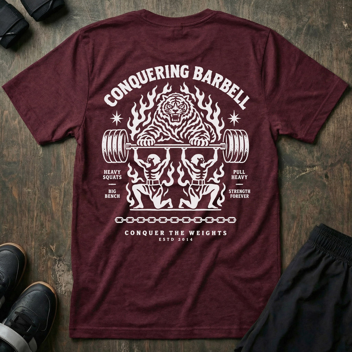 Throne Bearers tee in Maroon: two jacked lifters on their knees bearing a loaded barbell overhead