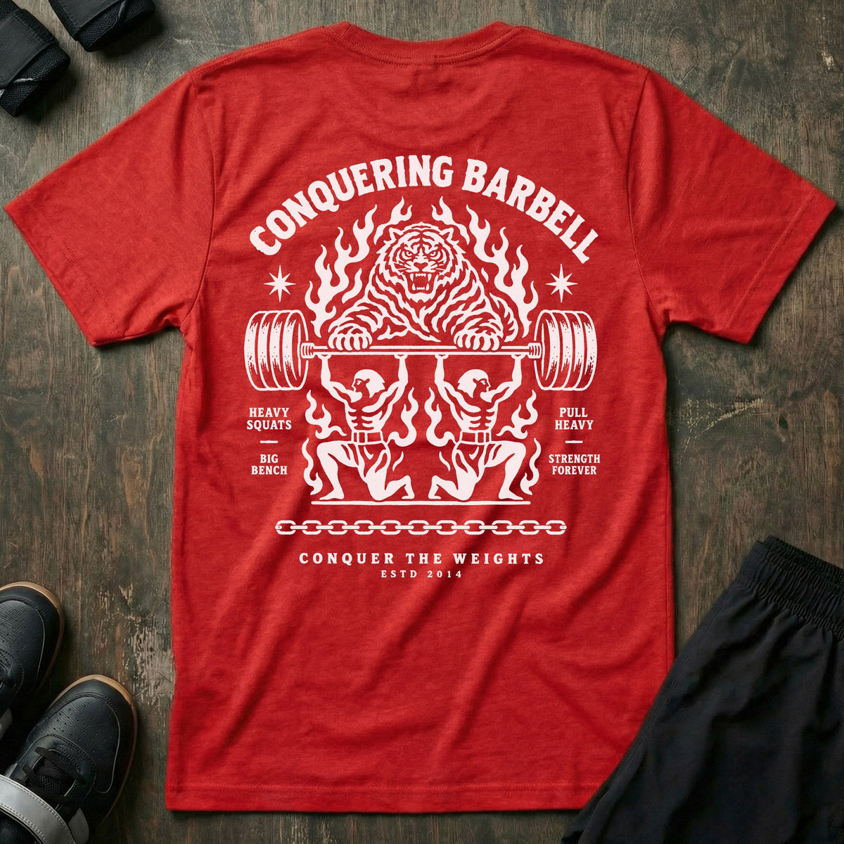 Throne Bearers tee in Red: two jacked lifters on their knees bearing a loaded barbell overhead