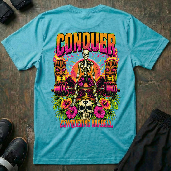 Tiki Power tee in Tahiti: a skeleton deadlifting a loaded barbell between two flaming tiki torches against a tropical sunset