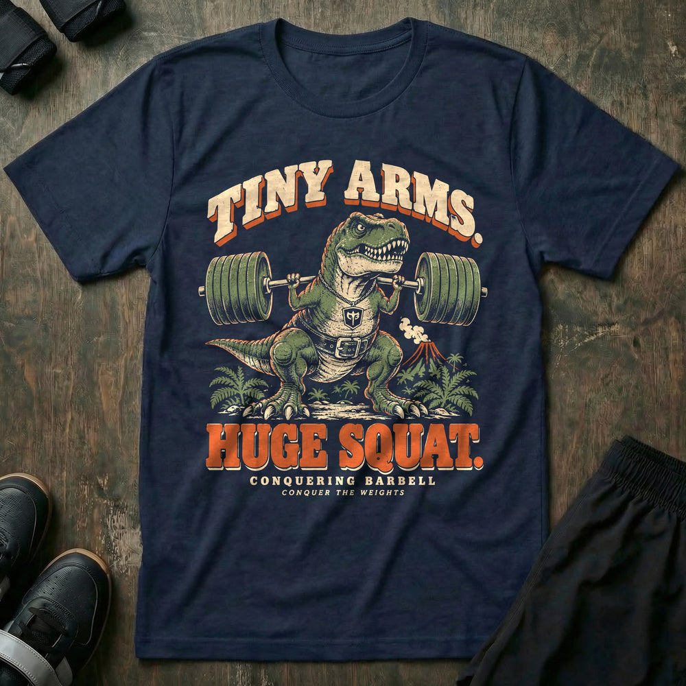 Tiny Arms Huge Squat - Tee front graphic in Navy with a T. rex in a lifting belt squatting a loaded barbell with tiny arms - Conquering Barbell
