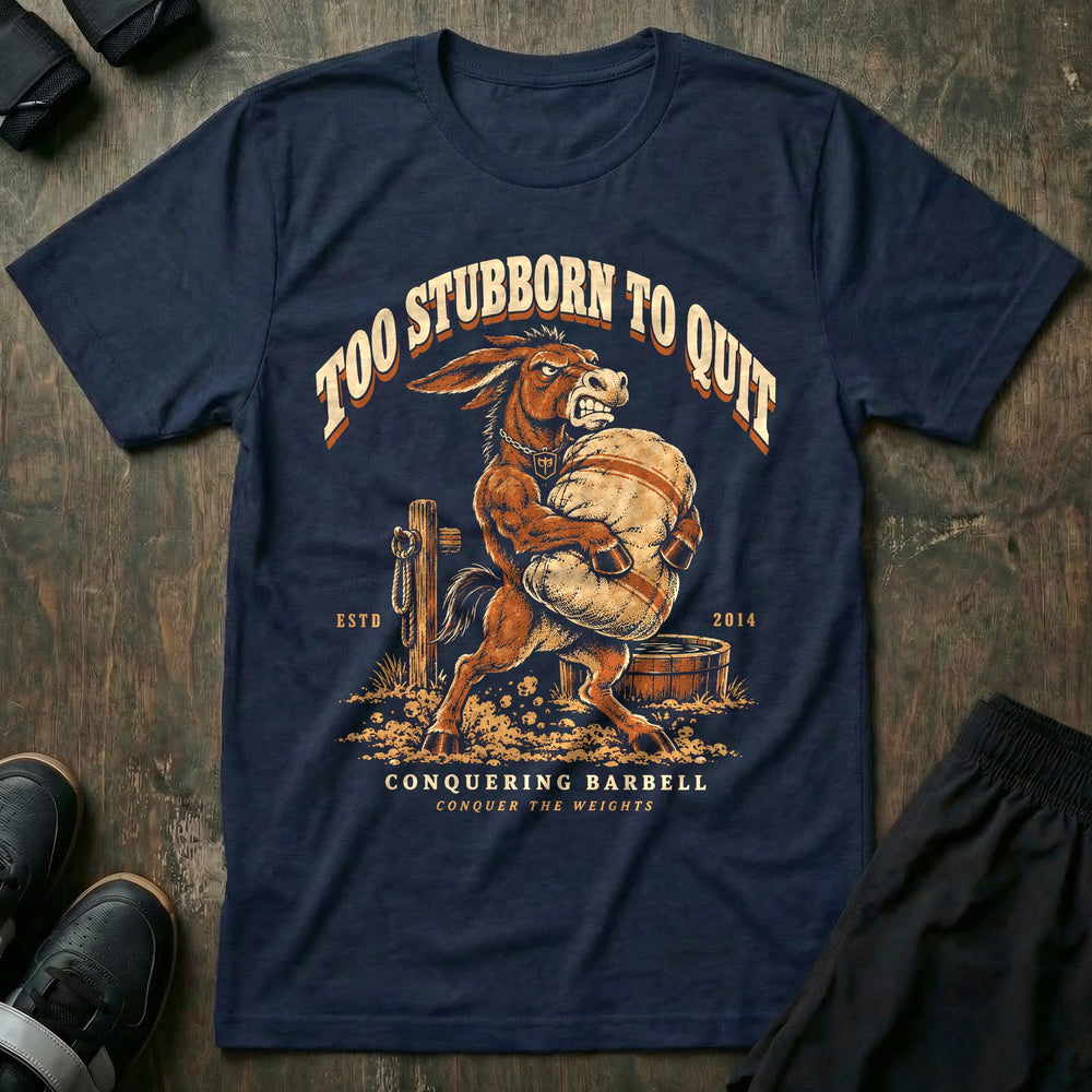 Too Stubborn to Quit - Tee front graphic in Navy with a mule with teeth bared carrying a heavy sandbag - Conquering Barbell