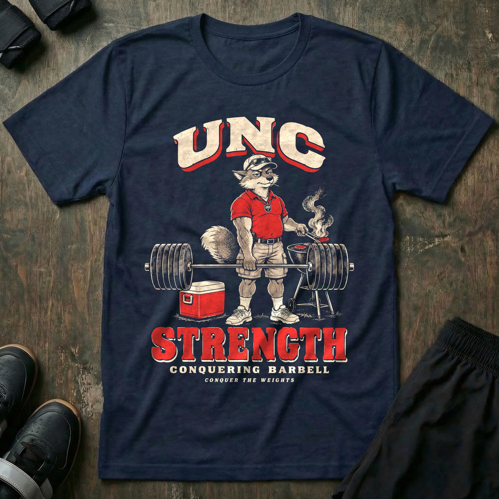Unc Strength - Tee front graphic in Navy with a silver fox in a polo holding a loaded barbell one-handed while flipping burgers on a grill - Conquering Barbell