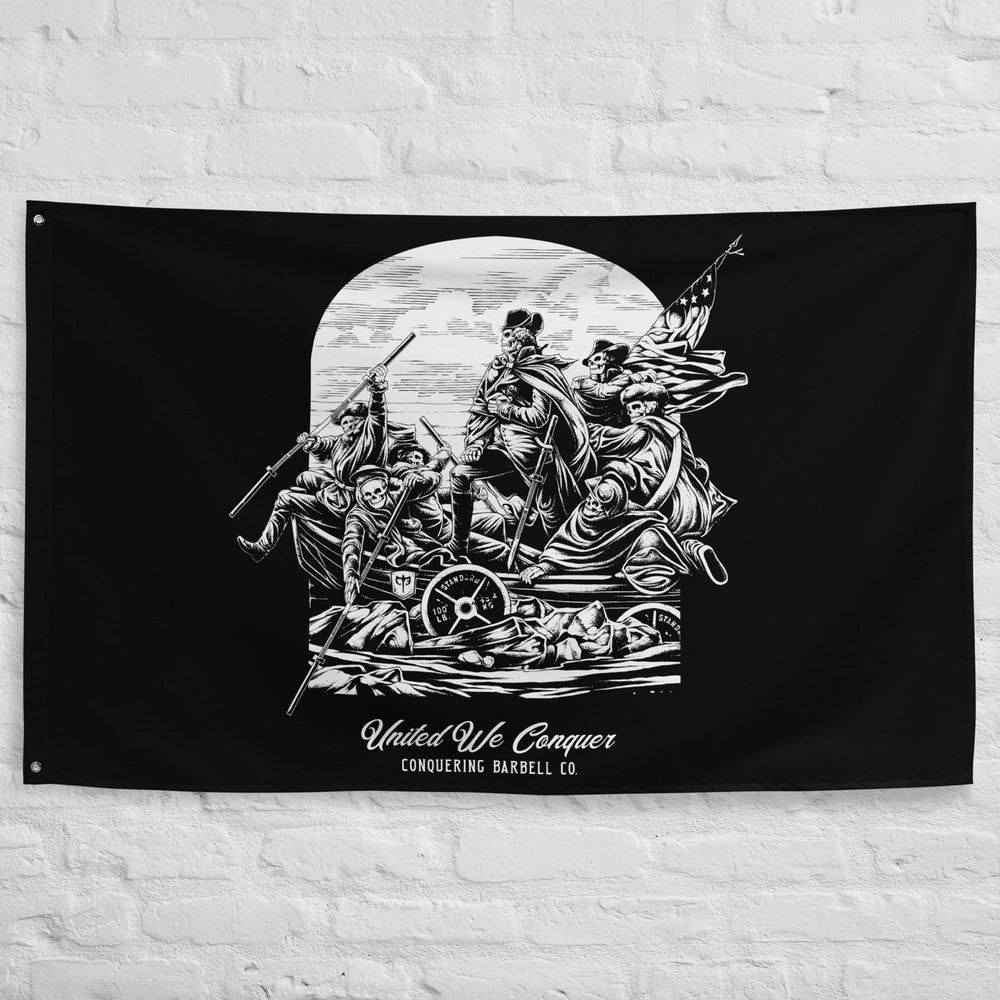 United We Conquer - Polyester Flag, horizontal gym flag hanging in a home gym - Conquering Barbell