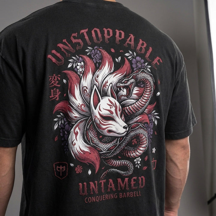 Unstoppable and Untamed relaxed fit tee in Black: a fierce kitsune fox spirit with serpent coiled around it
