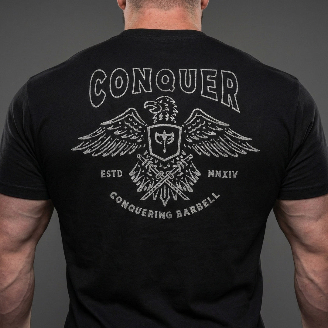 Talons Out tee in Black: an eagle with spread wings and the CB shield crest over crossed barbells