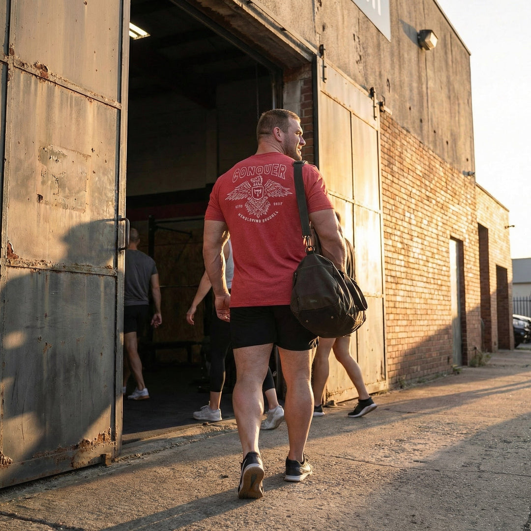 Talons Out tee in Red: an eagle with spread wings and the CB shield crest over crossed barbells