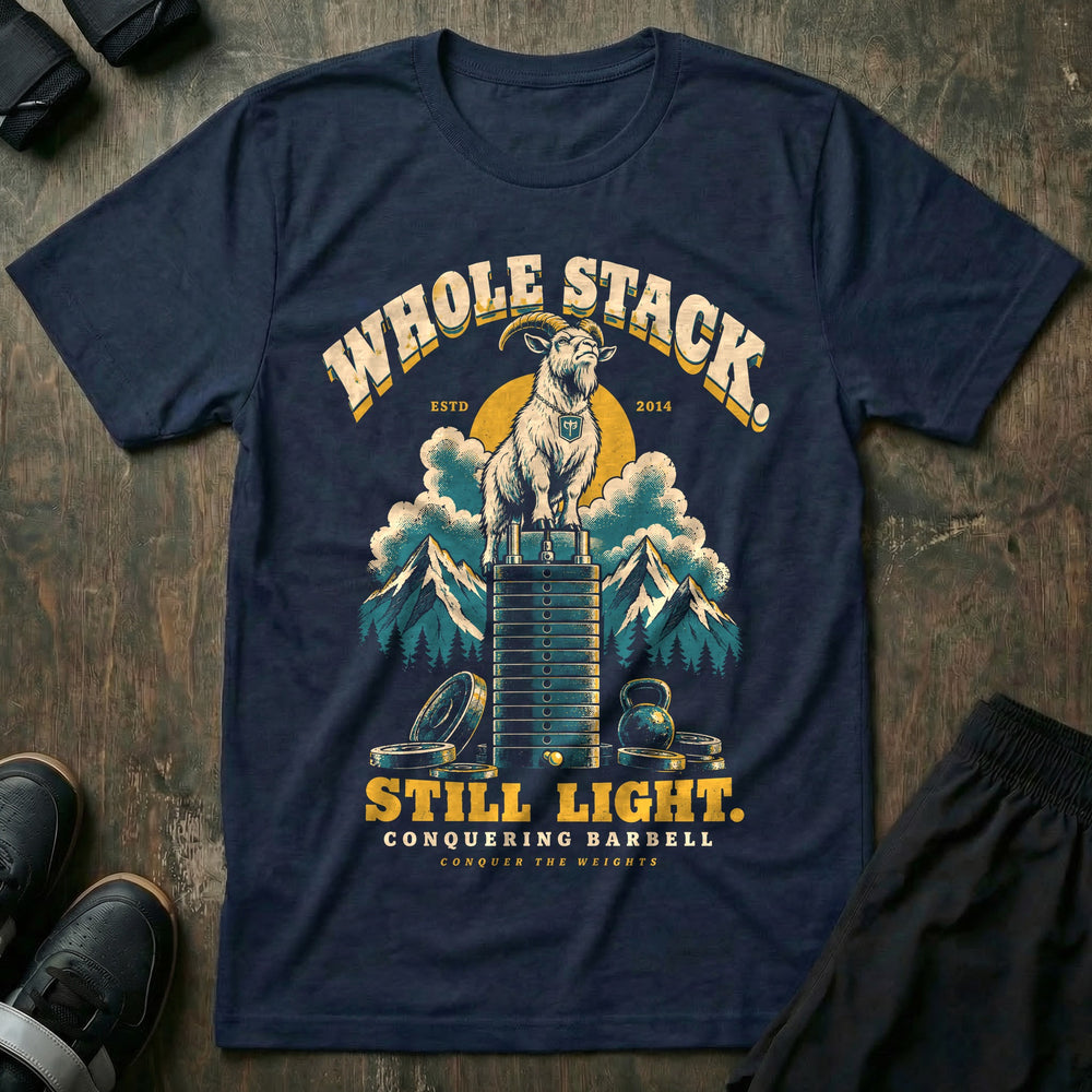 Whole Stack Still Light - Tee front graphic in Navy with a mountain goat standing on top of a machine weight stack above the clouds - Conquering Barbell