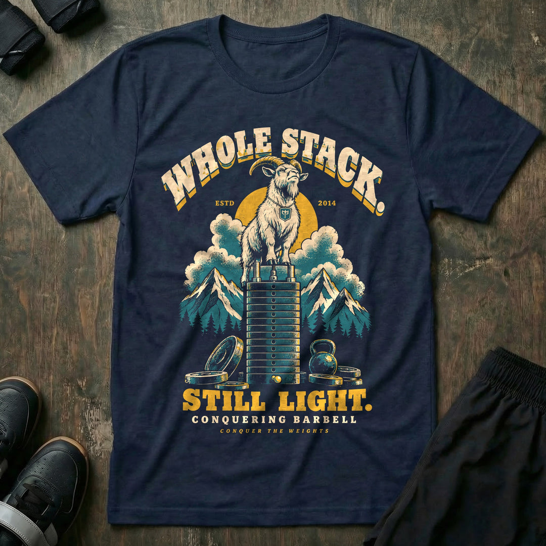 Whole Stack Still Light - Tee front graphic in Navy with a mountain goat standing on top of a machine weight stack above the clouds - Conquering Barbell
