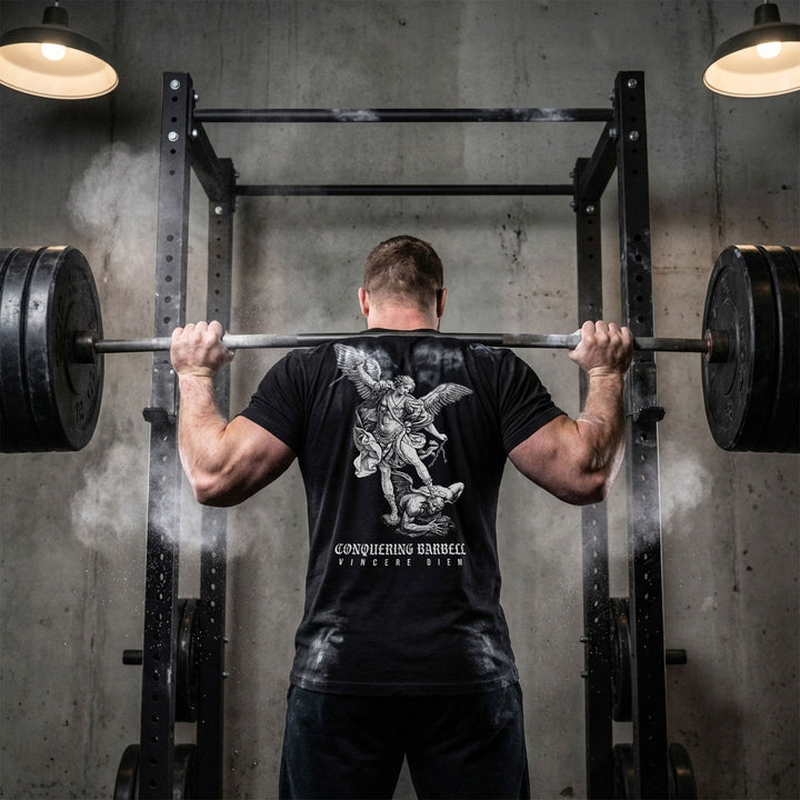 Win the Day Angel vs Dem tee in Black: a winged guardian driving his weapon down on a demon in a classic engraving style