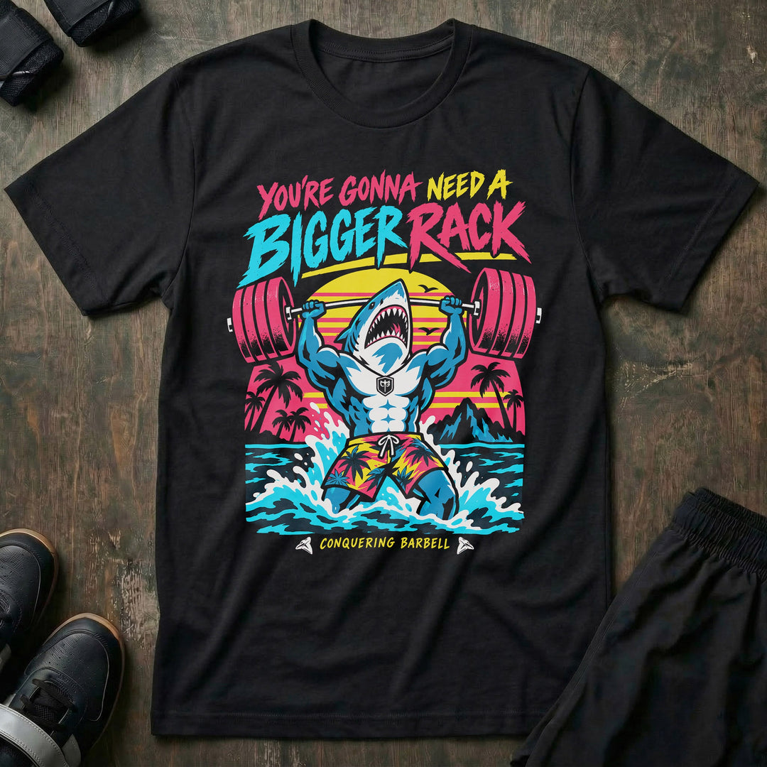 You're Gonna Need A Bigger Rack tee in Black: a jacked great white shark bursting out of the ocean in board shorts
