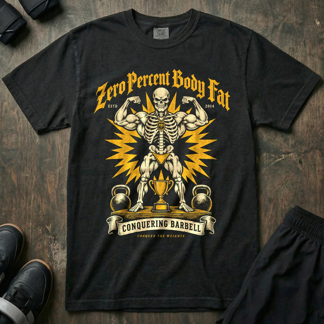 Zero Percent Body Fat - Relaxed Fit Tee front graphic in Black with a skeleton in gold posing trunks hitting a front double biceps on stage - Conquering Barbell