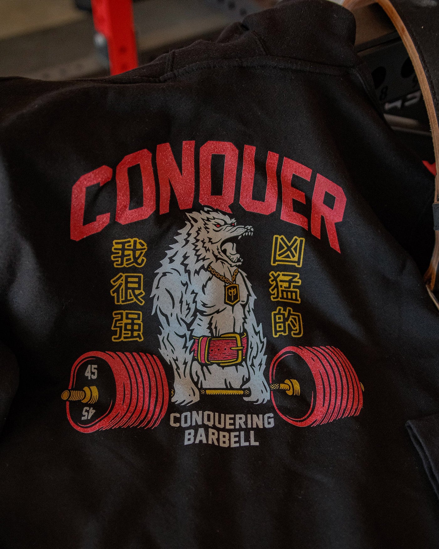 Conquer - Deadlifting Wolf V2 - on Black Pullover Hoodie - Conquering Barbell