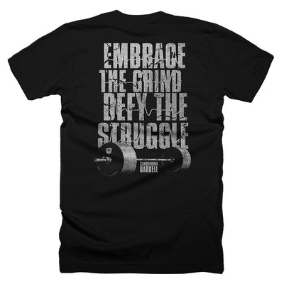 Embrace the Grind, Defy the Struggle - on Black Tee - Conquering Barbell