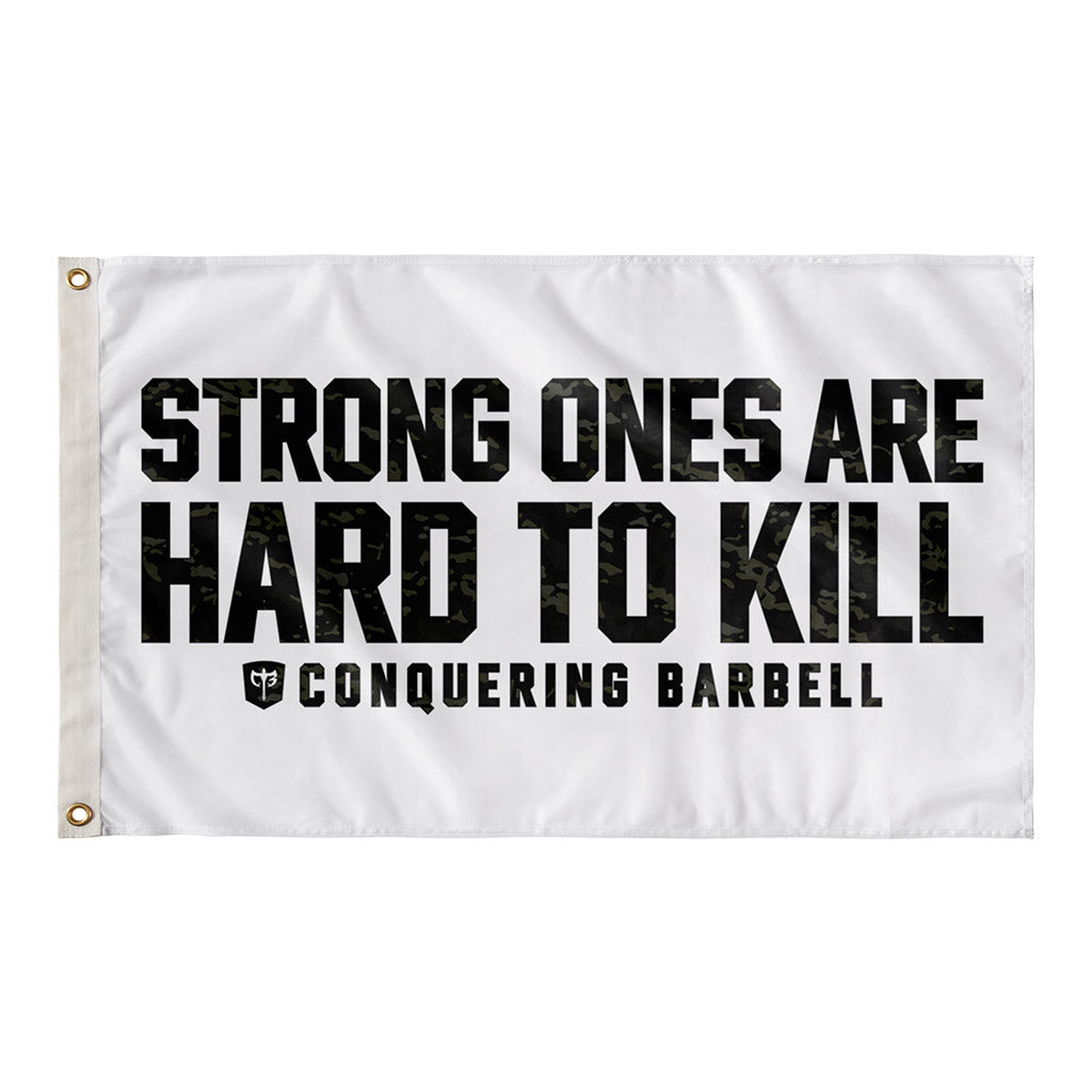 Strong Ones are Hard to Kill - Black Camo - Polyester Flag, horizontal gym flag hanging in a home gym - Conquering Barbell