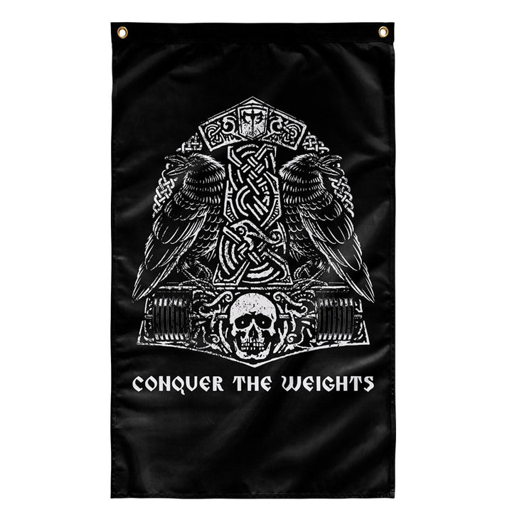 The Hammer &amp; The Ravens Flag - Polyester Flag, vertical gym flag hanging in a home gym - Conquering Barbell